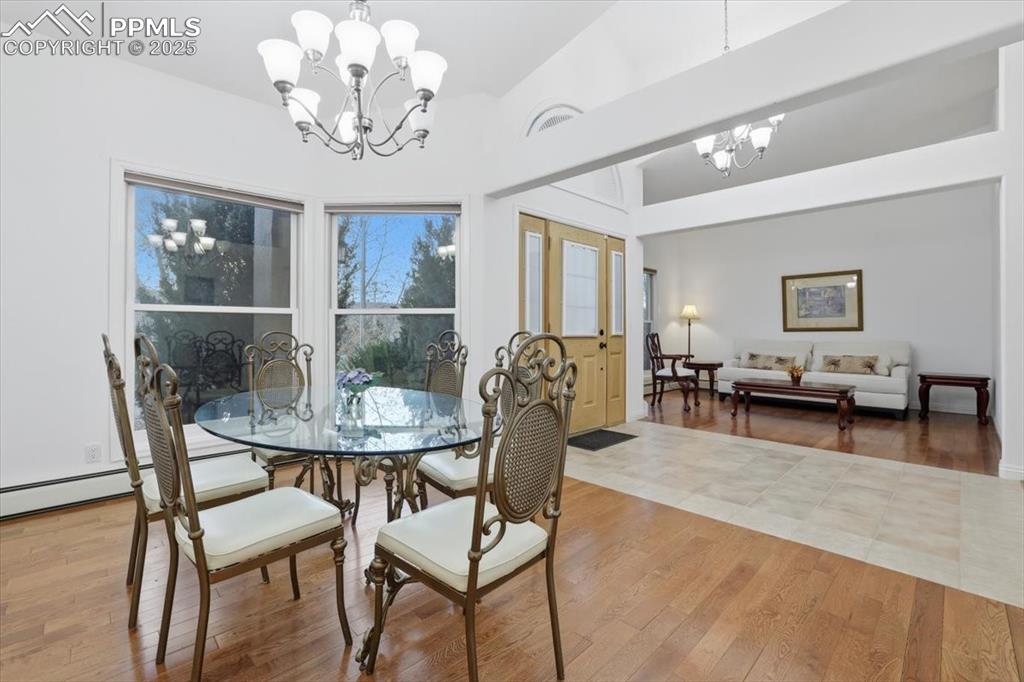 10 Desert Inn Way Colorado Springs, CO 80921 - Photo 7 of 26 a view of a dining room with furniture and chandelier