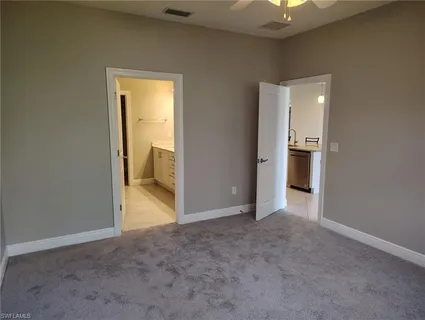 an empty room with a bathroom and a bathroom