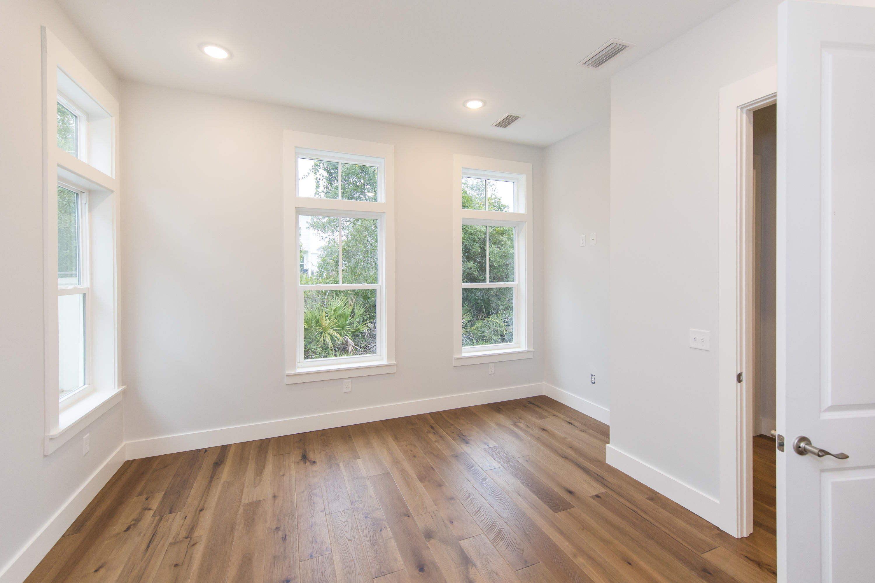 176 Grande Pointe Cirlce Inlet Beach Inlet Beach, FL 32461 - Photo 12 of 29 an empty room with wooden floor and windows