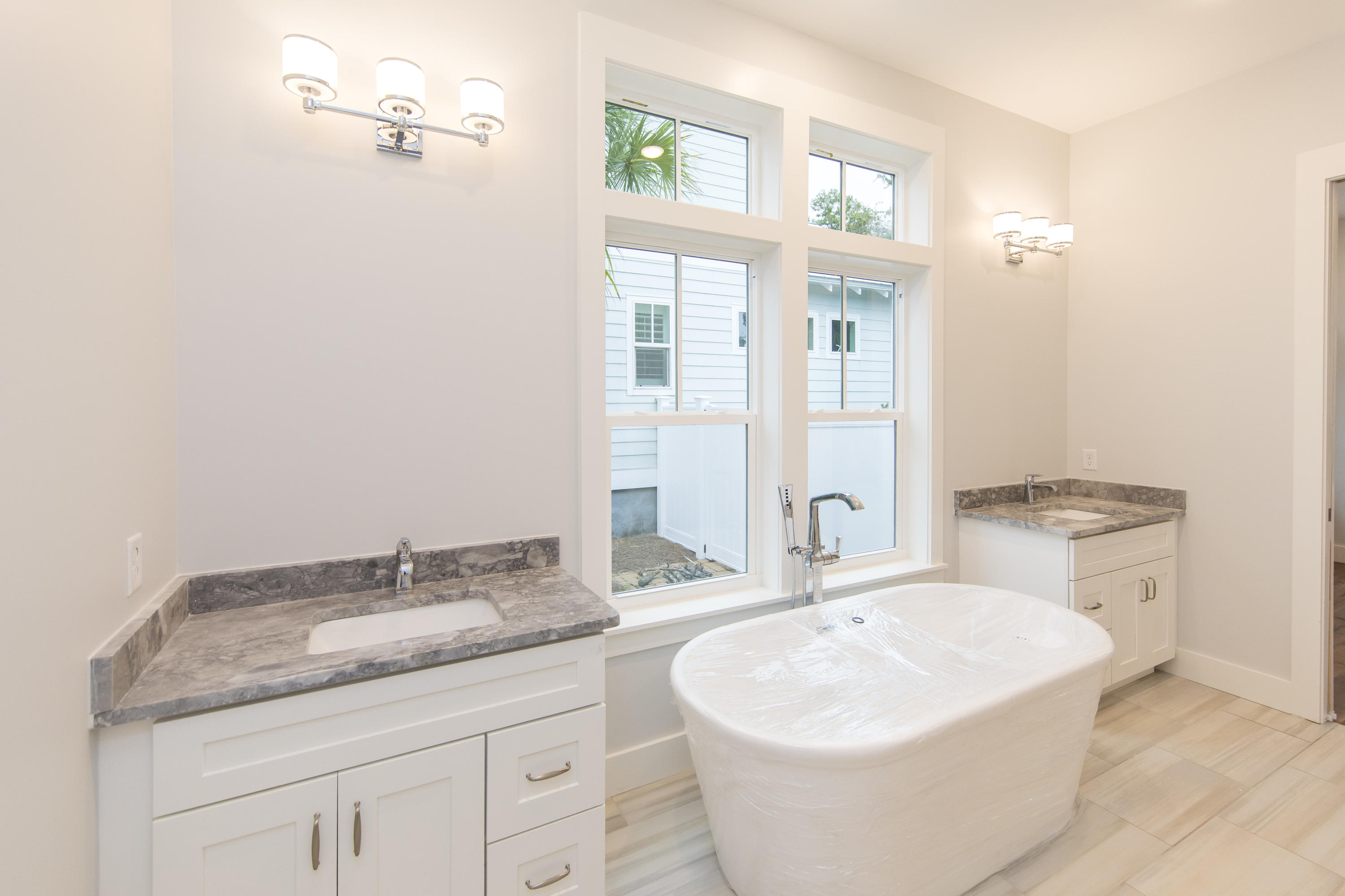 176 Grande Pointe Cirlce Inlet Beach Inlet Beach, FL 32461 - Photo 15 of 29 a bathroom with a granite countertop sink and a mirror