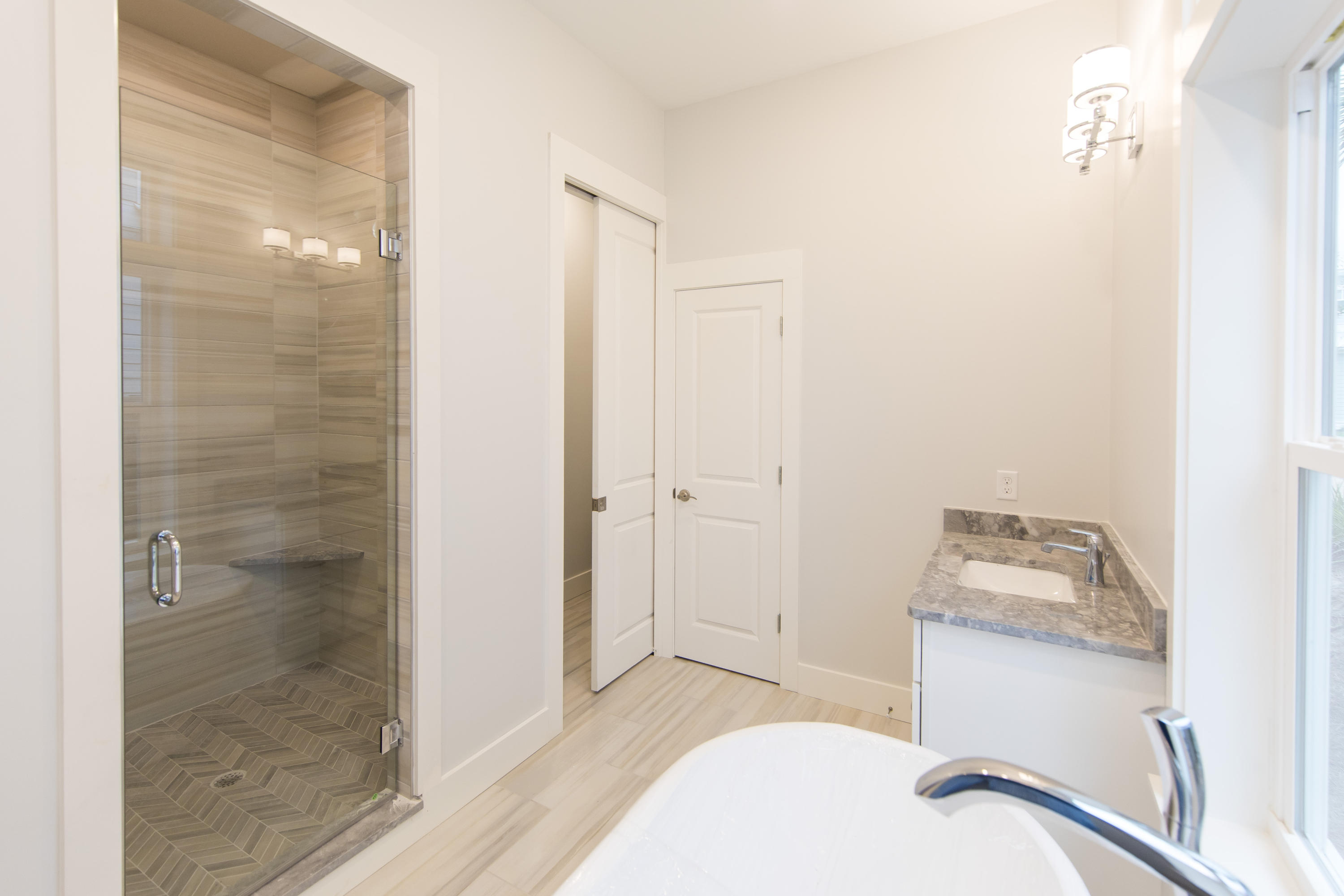 176 Grande Pointe Cirlce Inlet Beach Inlet Beach, FL 32461 - Photo 16 of 29 a bathroom with a sink and shower