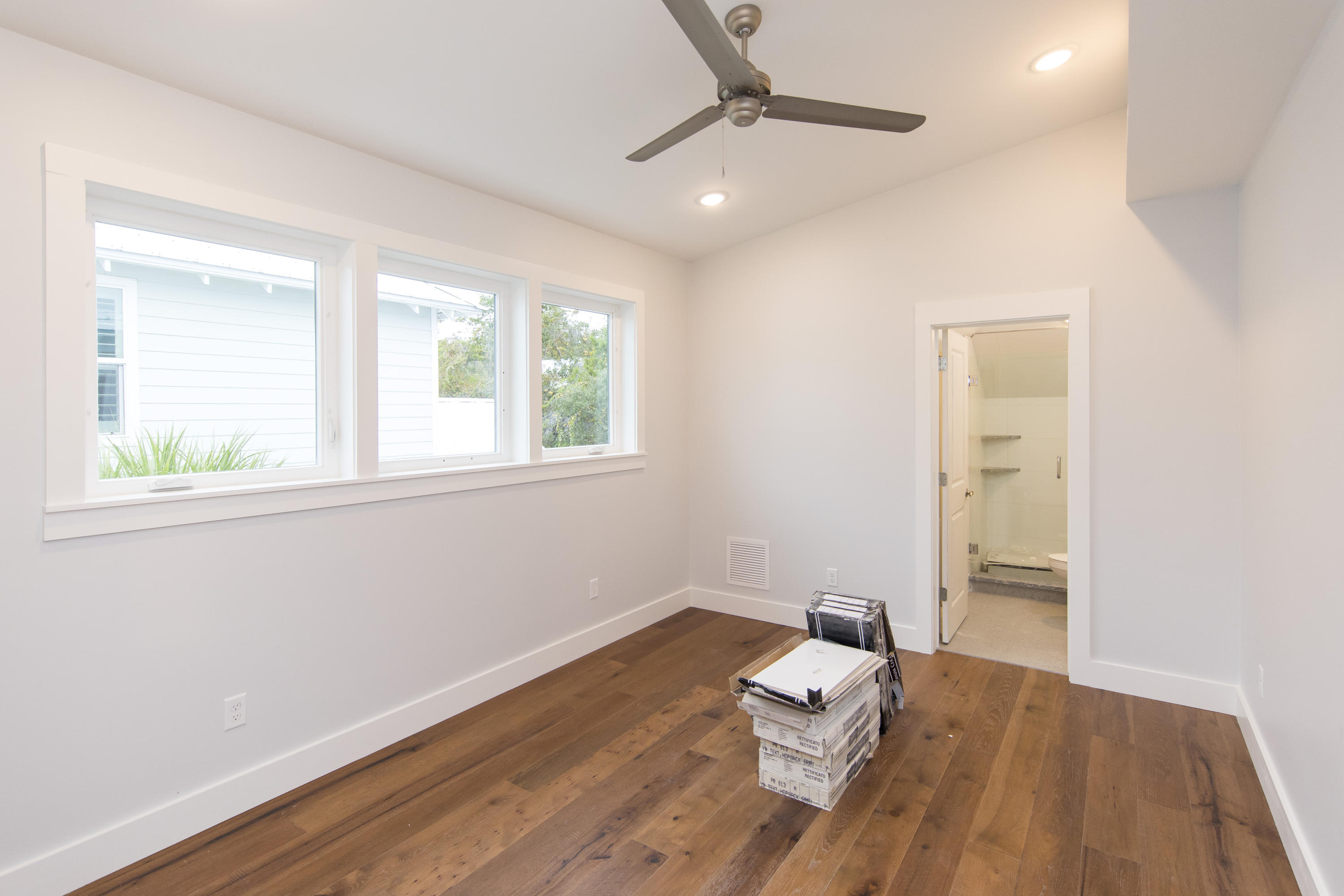 176 Grande Pointe Cirlce Inlet Beach Inlet Beach, FL 32461 - Photo 21 of 29 a room with wooden floor and a window