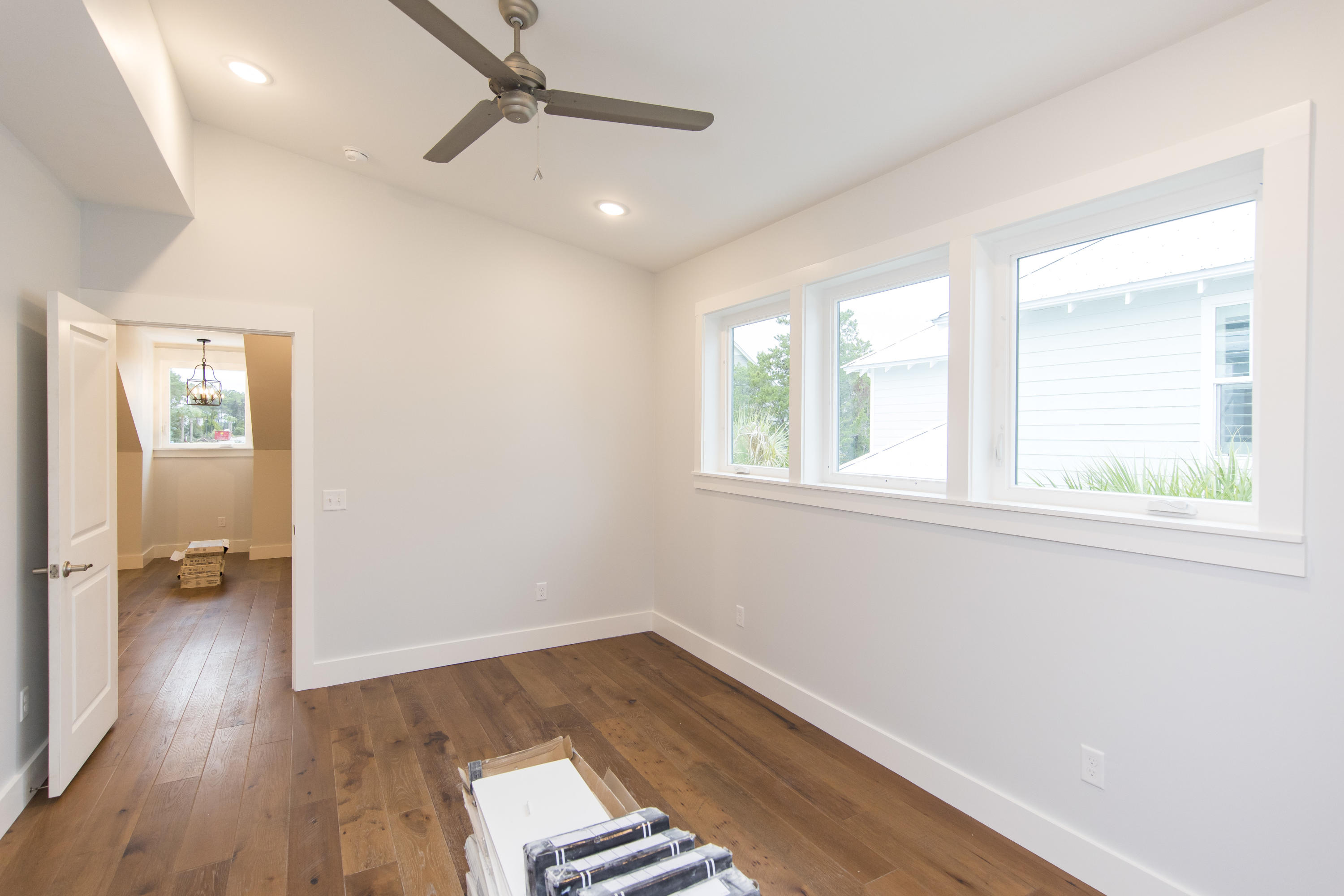 176 Grande Pointe Cirlce Inlet Beach Inlet Beach, FL 32461 - Photo 22 of 29 an empty room with wooden floor and windows