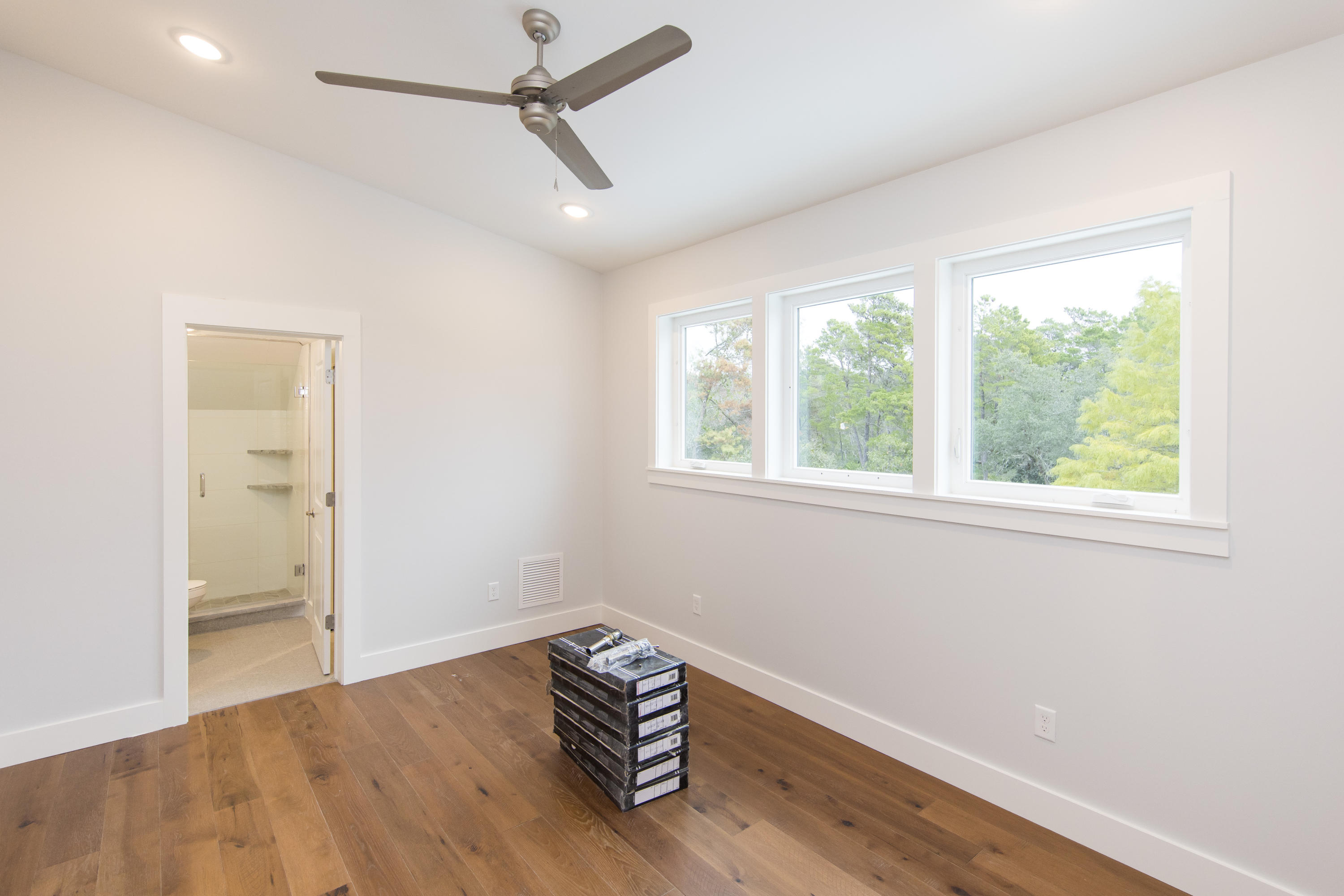 176 Grande Pointe Cirlce Inlet Beach Inlet Beach, FL 32461 - Photo 24 of 29 a room with window and a wooden floor