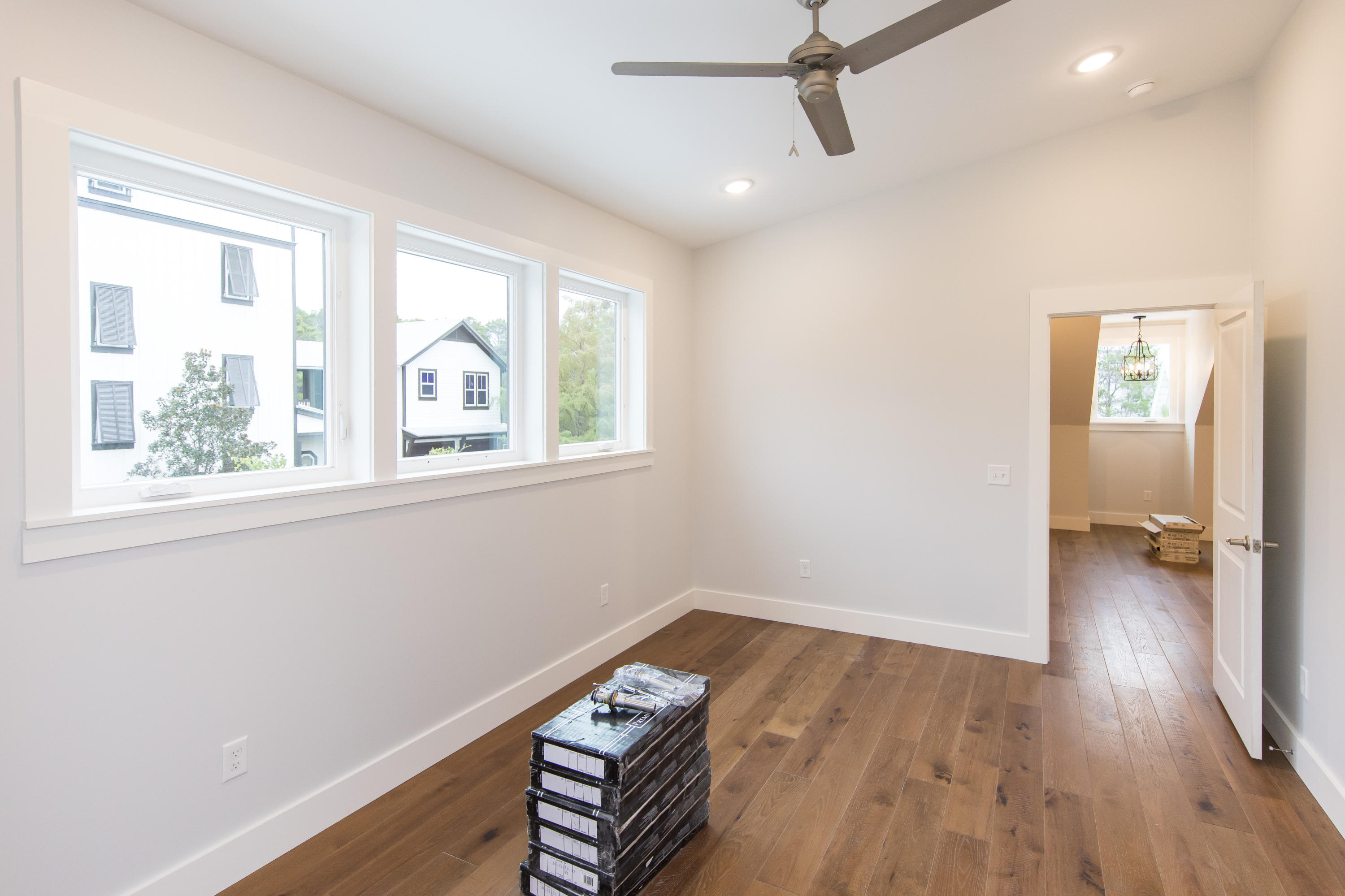 176 Grande Pointe Cirlce Inlet Beach Inlet Beach, FL 32461 - Photo 25 of 29 a view of empty room with wooden floor and fan
