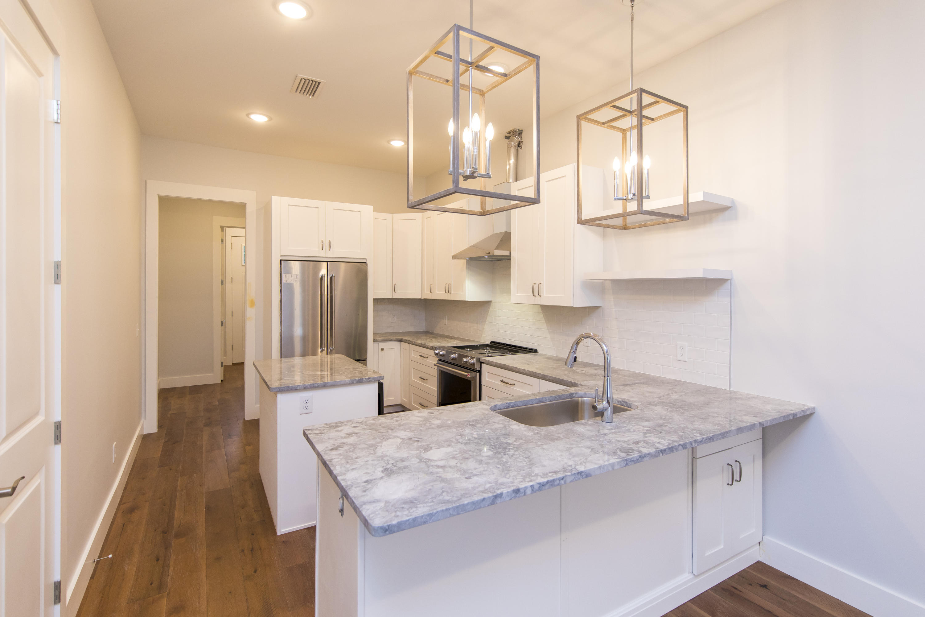 176 Grande Pointe Cirlce Inlet Beach Inlet Beach, FL 32461 - Photo 3 of 29 a kitchen with stainless steel appliances granite countertop a sink a refrigerator and a wooden floors
