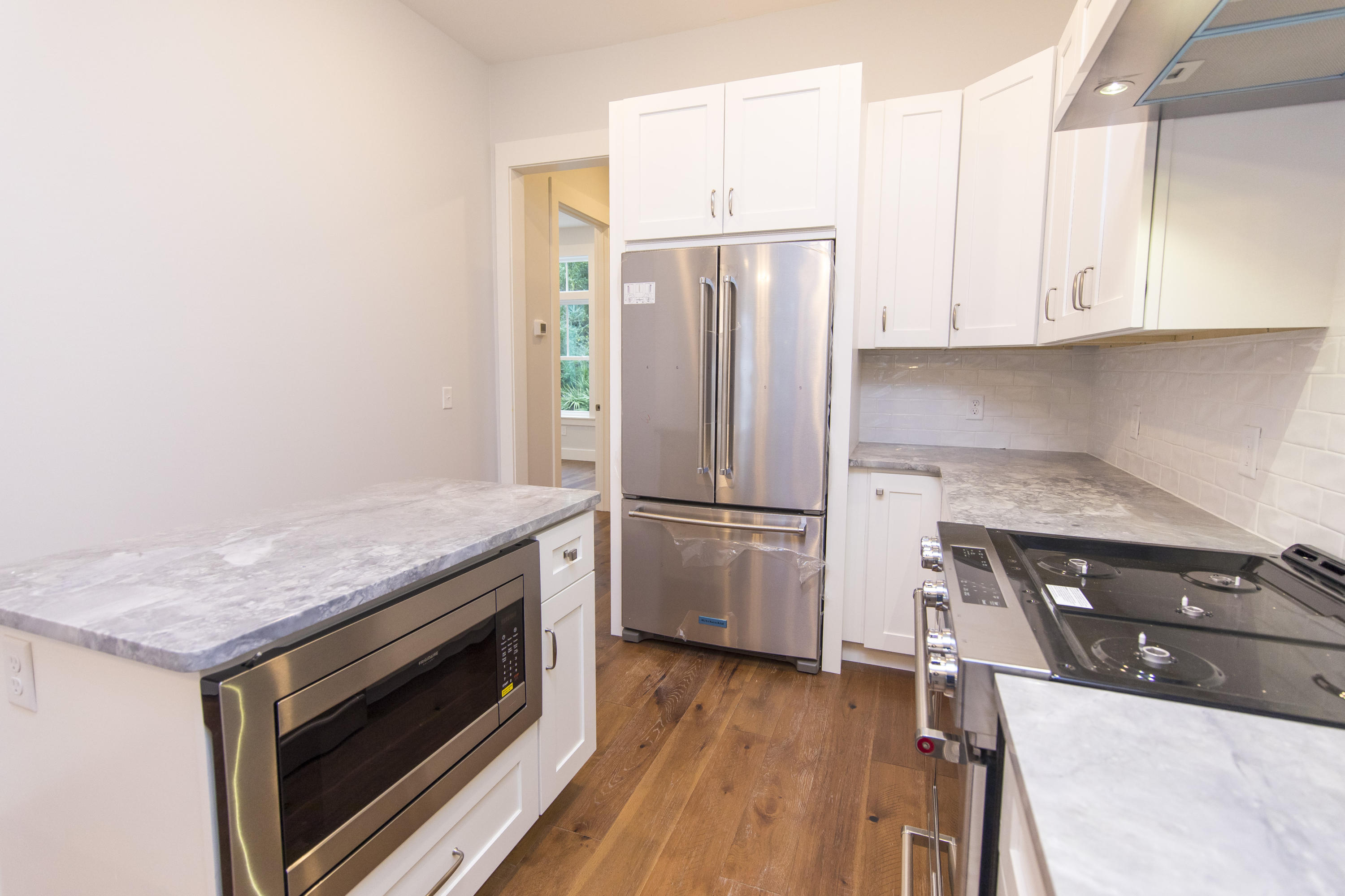176 Grande Pointe Cirlce Inlet Beach Inlet Beach, FL 32461 - Photo 5 of 29 a kitchen with a stove a refrigerator and a cabinets