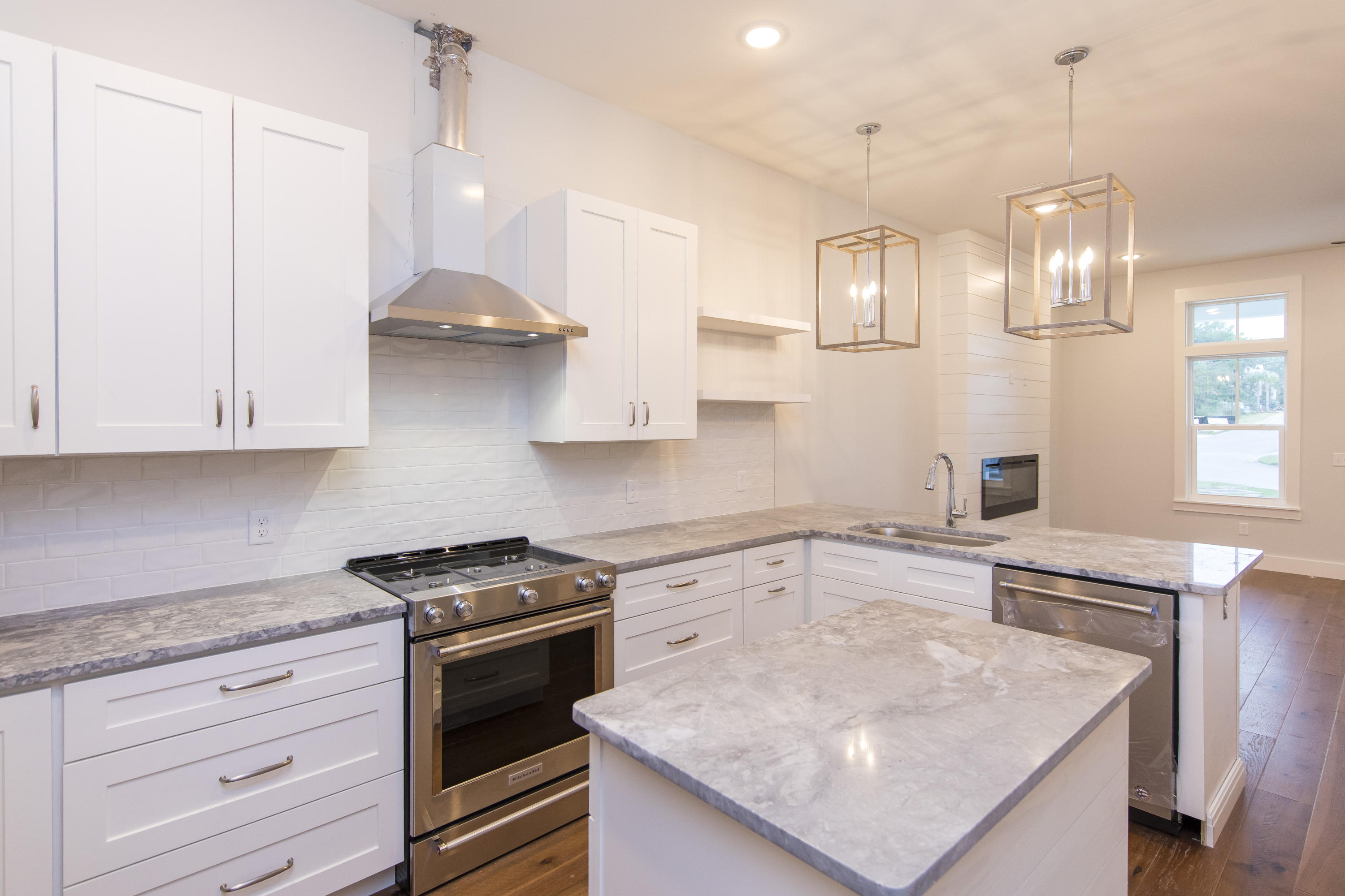 176 Grande Pointe Cirlce Inlet Beach Inlet Beach, FL 32461 - Photo 6 of 29 a kitchen with stainless steel appliances granite countertop a sink a stove and a refrigerator