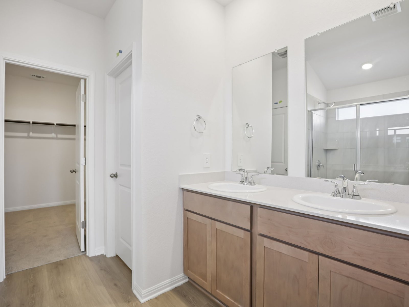 616 Timbo Drive Jarrell, TX 76537 - Photo 10 of 12 a bathroom with a double vanity sink mirror and shower