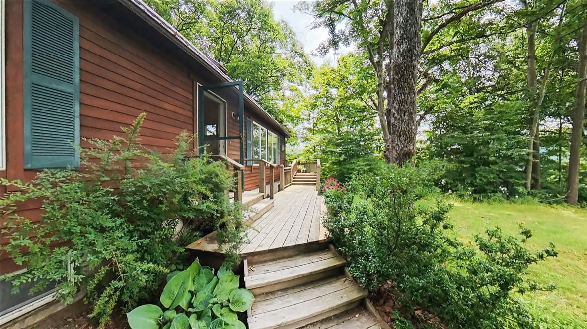 138 Vito Molinari Road Oneonta, NY 13820 - Photo 6 of 38 The far stairs lead to the deck overlooking the waterfront
