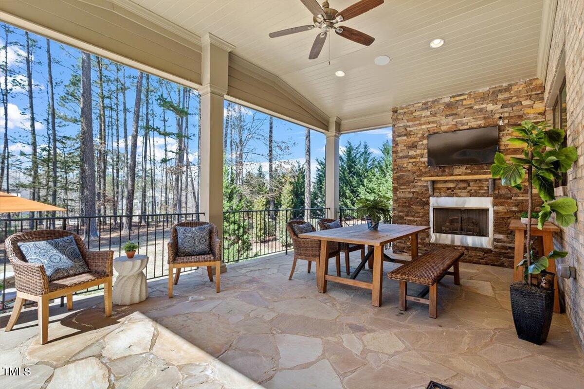 1001 Welch Lane Raleigh, NC 27614 - Photo 33 of 53 Rear Porch with Fireplace and TV