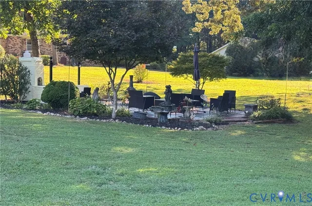 a view of a swimming pool with a yard