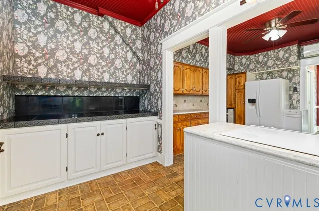 a view of a bathroom with tub and sink