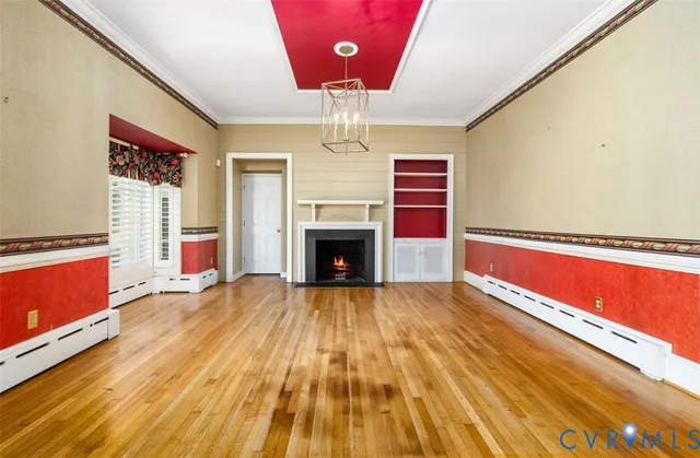 a living room with a flat screen tv and a fireplace