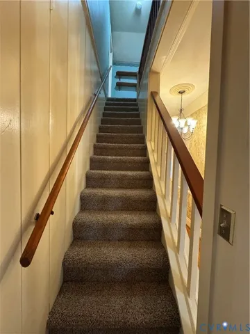 a view of empty room with a fireplace and windows
