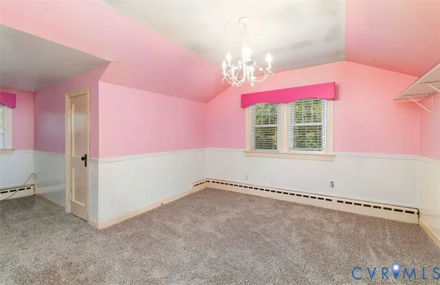 a bathroom with a bathtub a window and a shower