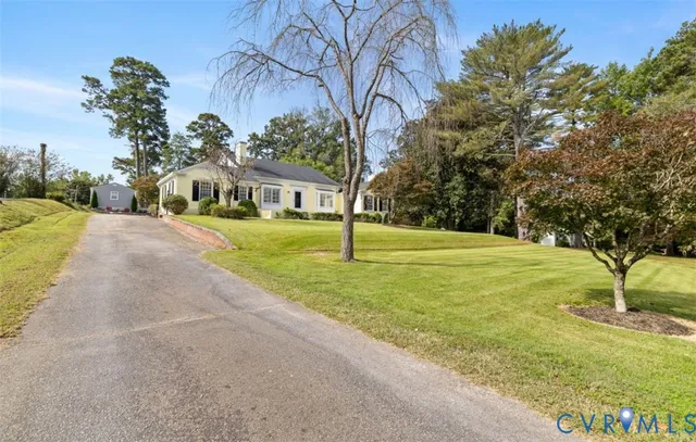 an aerial view of a house with a yard