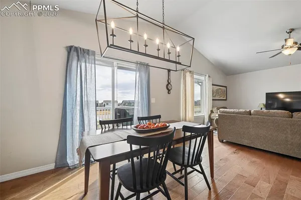 a dining room with furniture and window