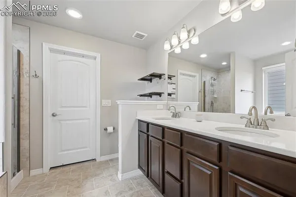 a bathroom with a sink a vanity and a mirror