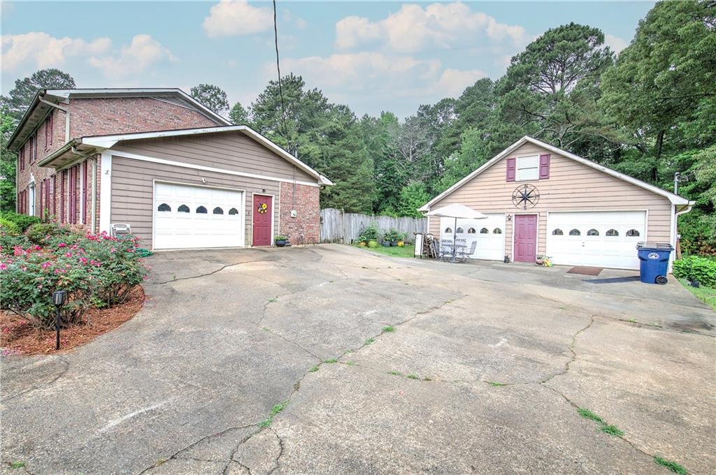3637 Nebo Road Hiram, GA 30141 - Photo 6 of 63 a front view of a house with a yard and garage