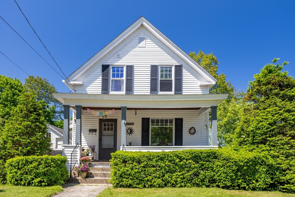 front view of a house with a yard