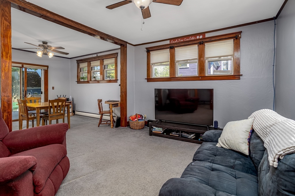 56 Orange Street Athol, MA 01331 - Photo 18 of 39 a living room with furniture a ceiling fan and a window
