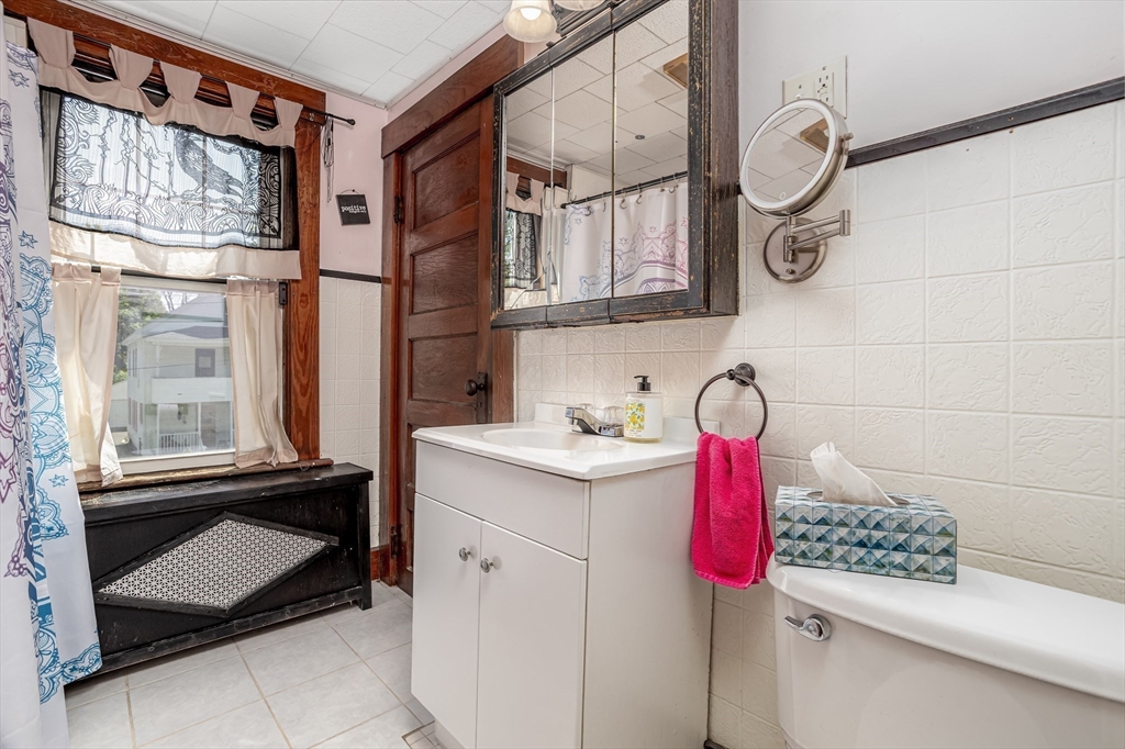 56 Orange Street Athol, MA 01331 - Photo 20 of 39 a bathroom with a sink vanity and mirror