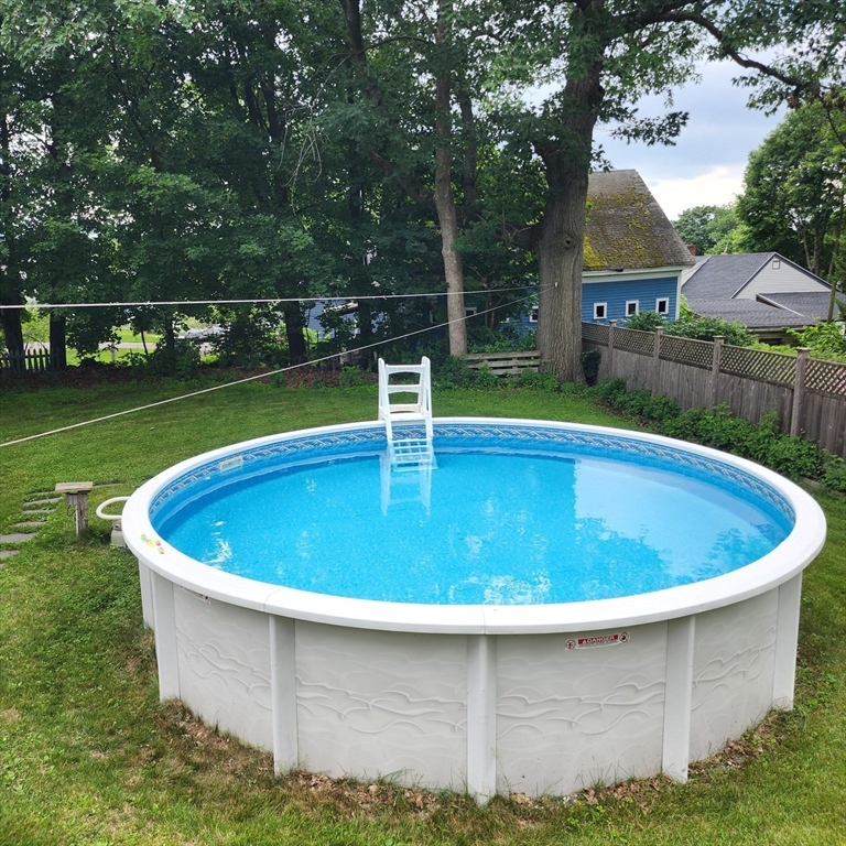 56 Orange Street Athol, MA 01331 - Photo 32 of 39 a view of a swimming pool and trees in the background
