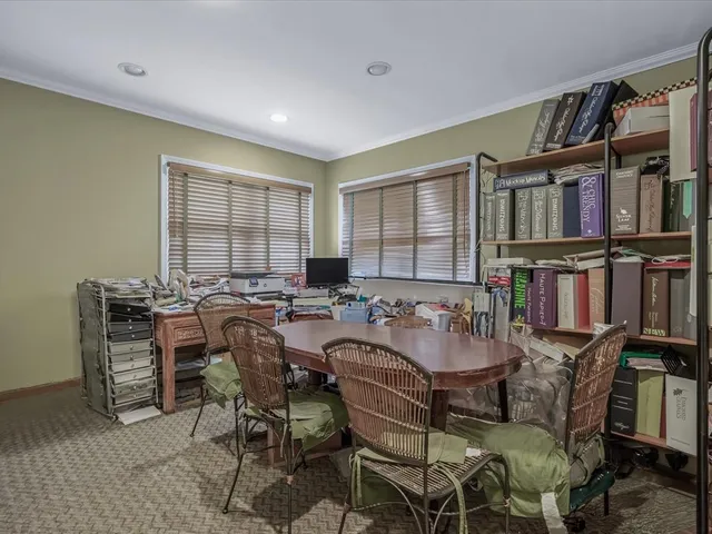 a bedroom with furniture and a window