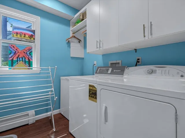 a room with a chandelier and a window