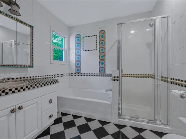 a view of a park with a large tree