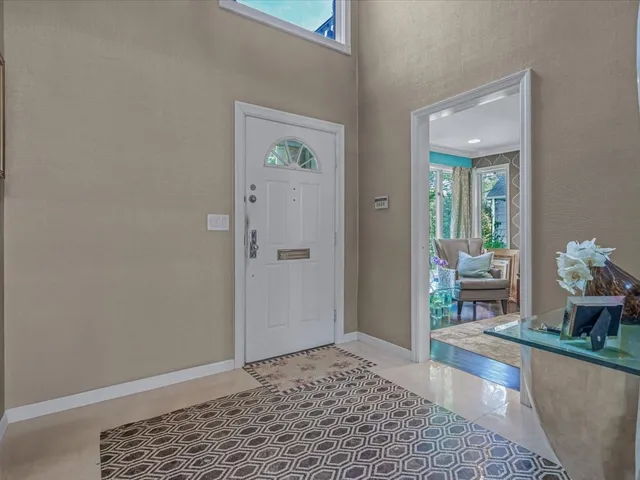 a living room with a couch and bookshelf