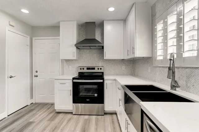 a kitchen with a stove and a refrigerator