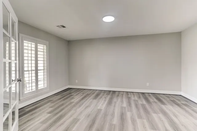 a view of an empty room and window