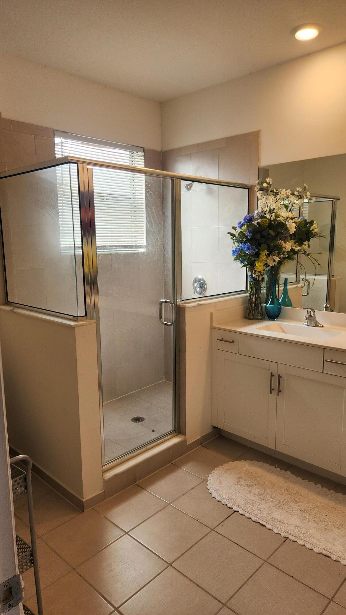 6002 Clydesdale Court Davie, FL 33314 - Photo 17 of 28 a bathroom with a sink mirror and shower