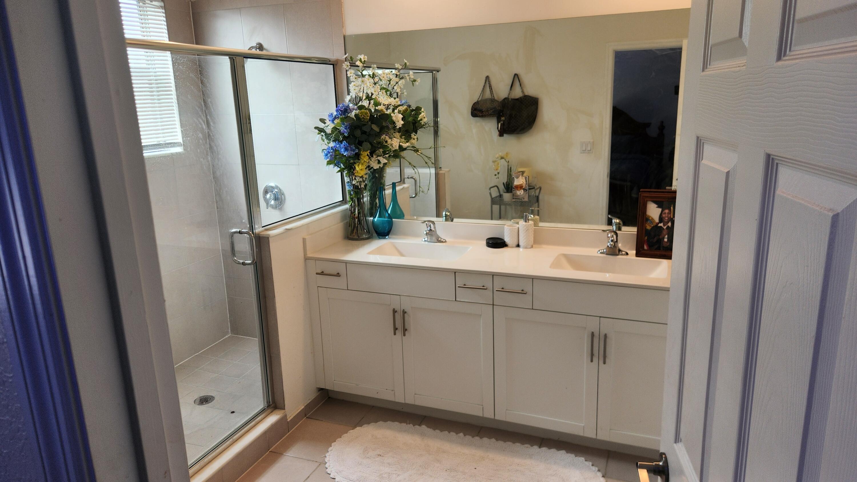 6002 Clydesdale Court Davie, FL 33314 - Photo 18 of 28 a bathroom with a sink and mirror