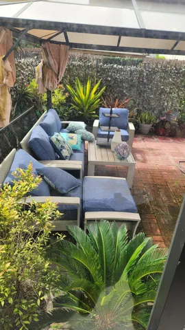 a view of a chairs in a backyard