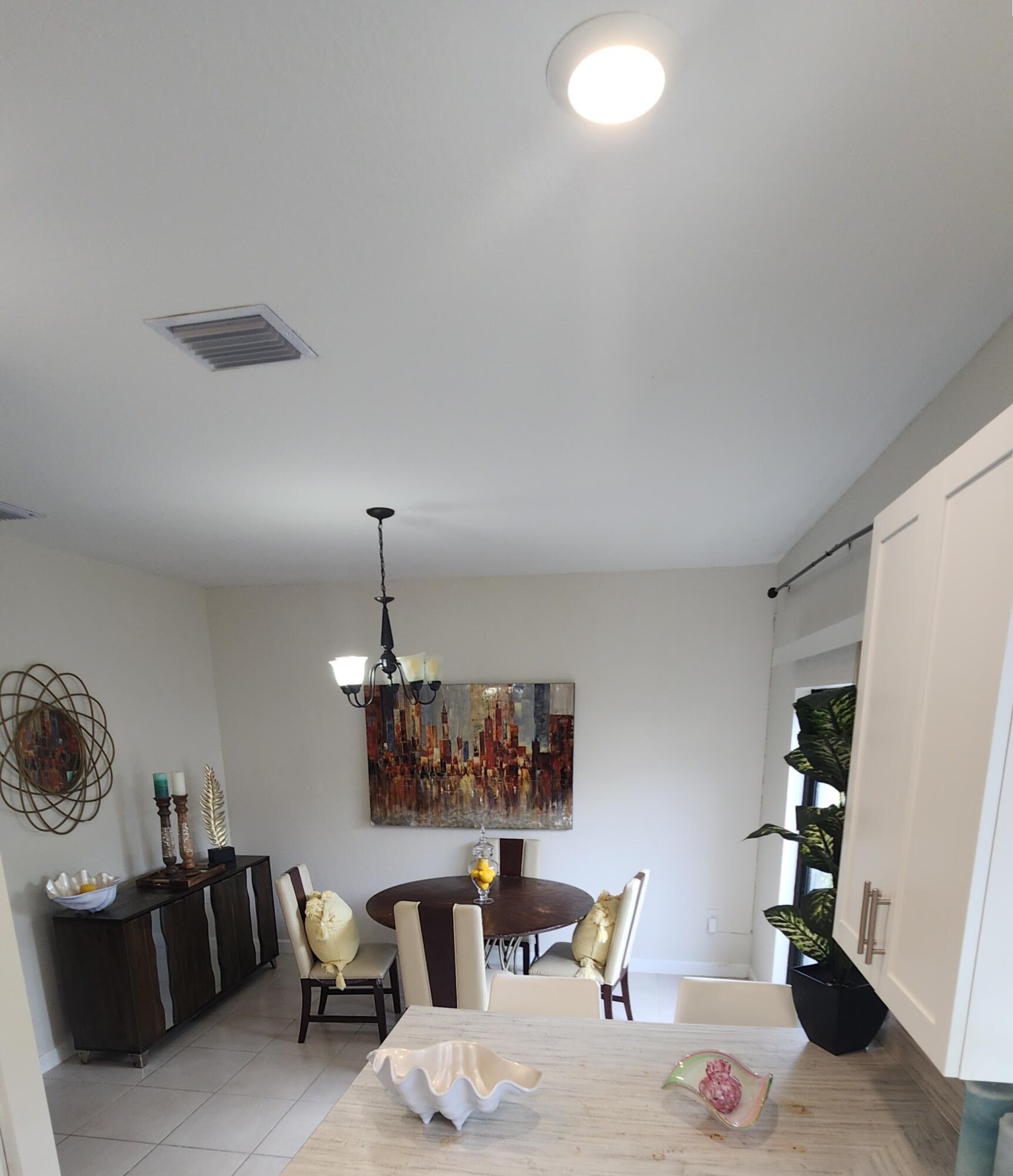 6002 Clydesdale Court Davie, FL 33314 - Photo 27 of 28 a living room with furniture a dining table and chairs with wooden floor