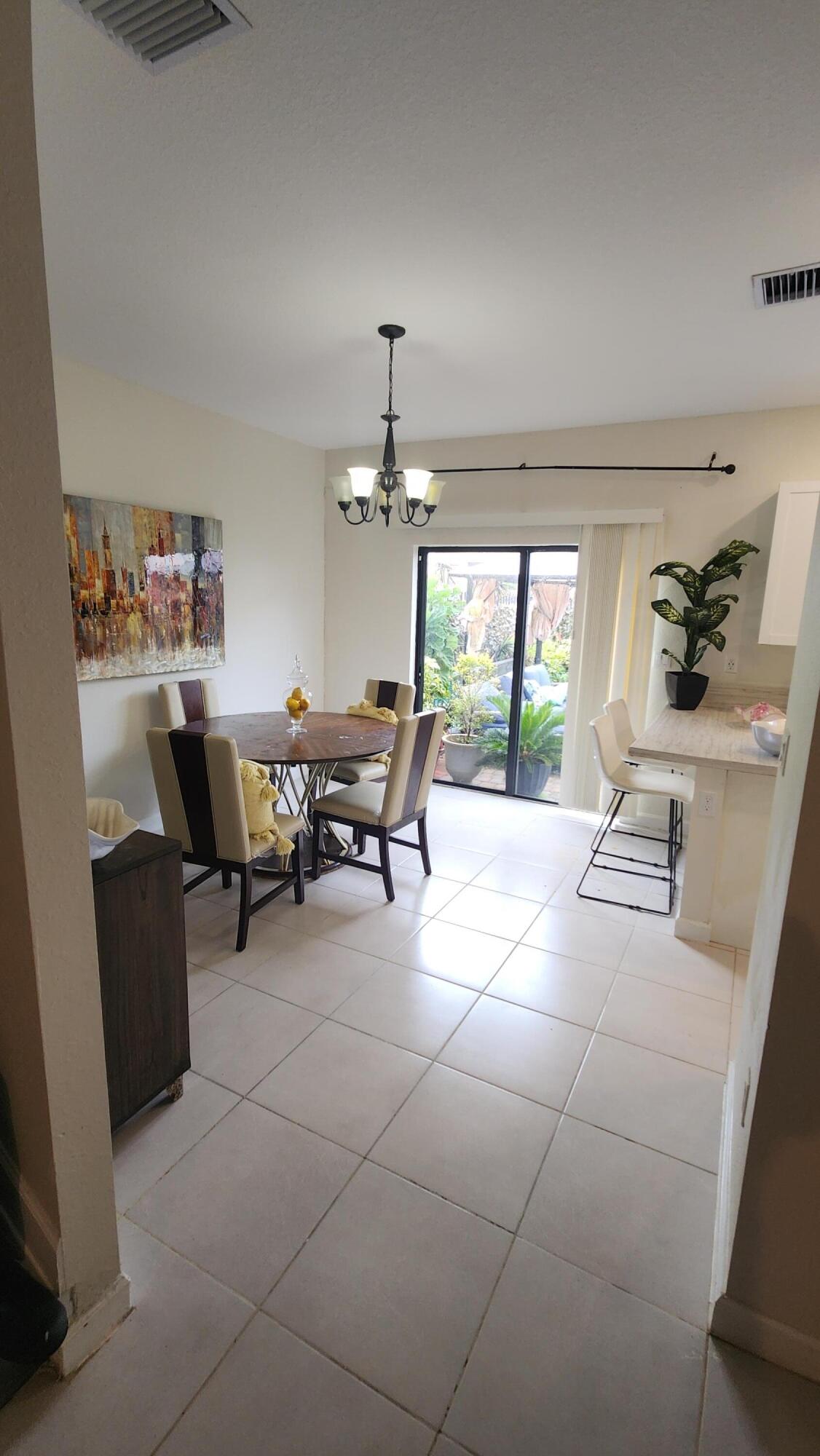 6002 Clydesdale Court Davie, FL 33314 - Photo 4 of 28 a room with furniture a chandelier and a window