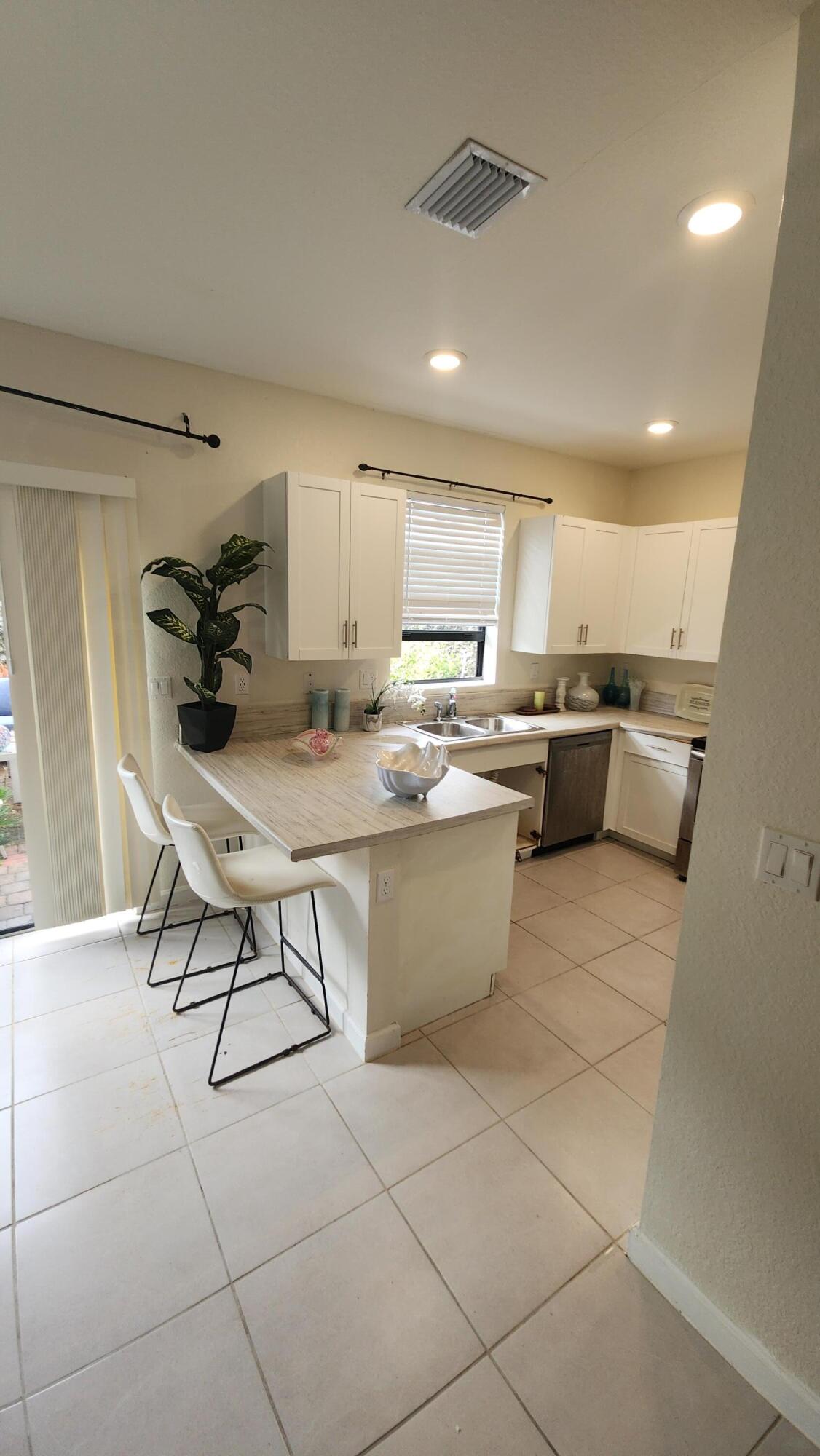 6002 Clydesdale Court Davie, FL 33314 - Photo 9 of 28 a kitchen with a sink cabinets and counter space