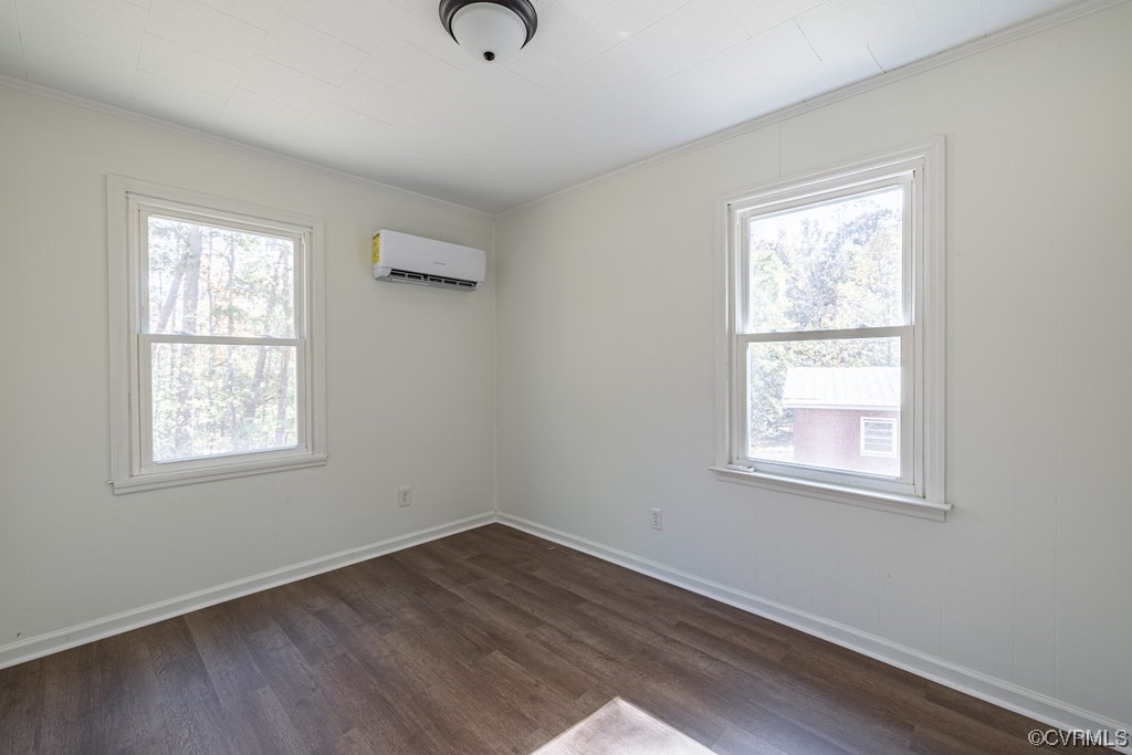 1122 Countyline Road Keysville, VA 23947 - Photo 11 of 20 an empty room with wooden floor and windows