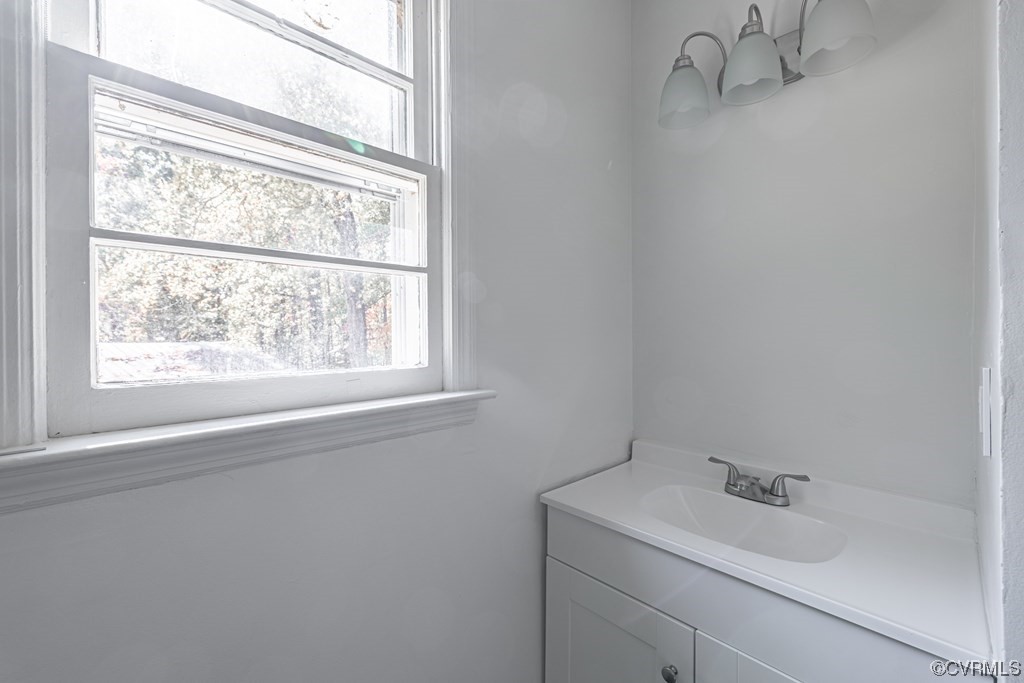 1122 Countyline Road Keysville, VA 23947 - Photo 14 of 20 a bathroom with a sink and a window