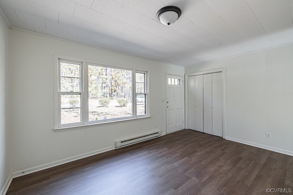 1122 Countyline Road Keysville, VA 23947 - Photo 2 of 20 an empty room with wooden floor and windows