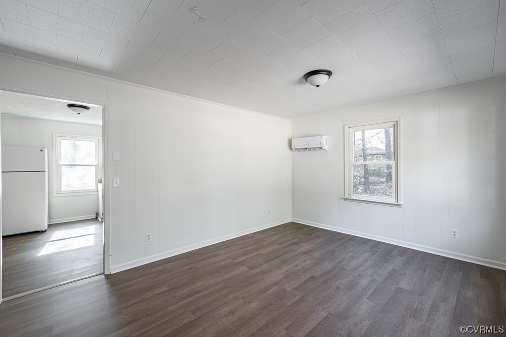 1122 Countyline Road Keysville, VA 23947 - Photo 4 of 20 an empty room with wooden floor and windows