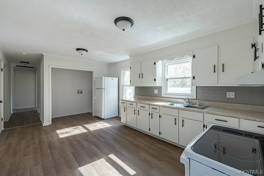 1122 Countyline Road Keysville, VA 23947 - Photo 10 of 20 a kitchen with granite countertop a sink cabinets wooden floor and stainless steel appliances