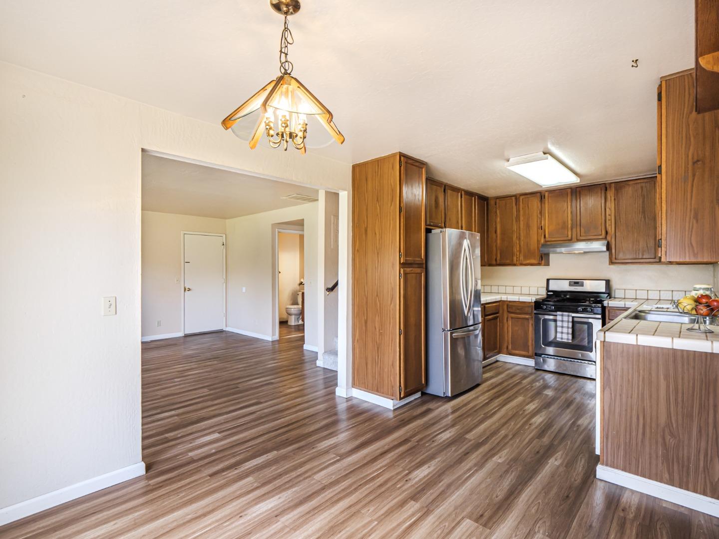 216 Silver Leaf Drive, Unit C Watsonville, CA 95076 - Photo 14 of 36 a view of a kitchen from the hallway