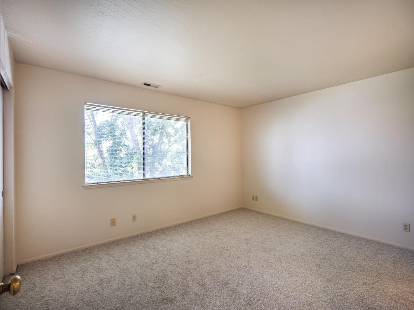 216 Silver Leaf Drive, Unit C Watsonville, CA 95076 - Photo 17 of 36 an empty room with a window