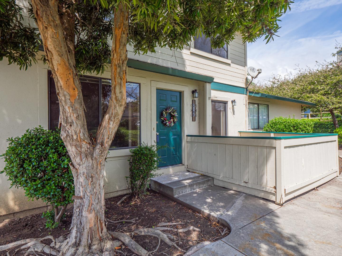 216 Silver Leaf Drive, Unit C Watsonville, CA 95076 - Photo 2 of 36 a front view of a house with garden