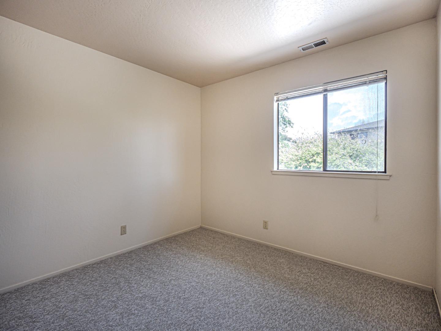 216 Silver Leaf Drive, Unit C Watsonville, CA 95076 - Photo 21 of 36 an empty room with a window