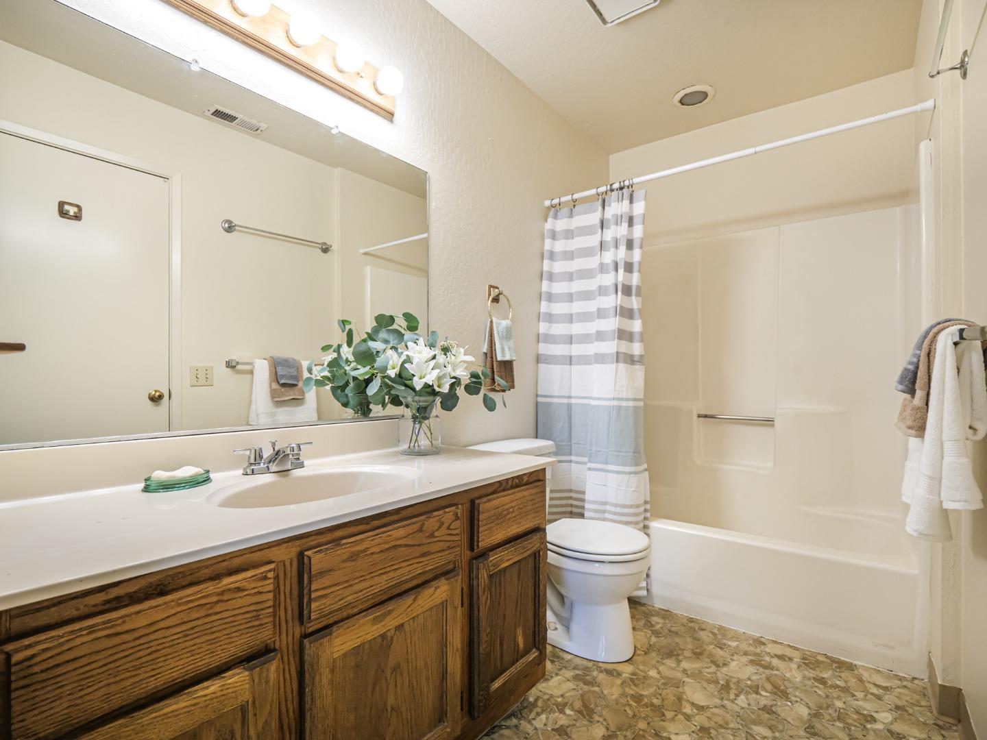 216 Silver Leaf Drive, Unit C Watsonville, CA 95076 - Photo 23 of 36 a bathroom with a sink a toilet and shower